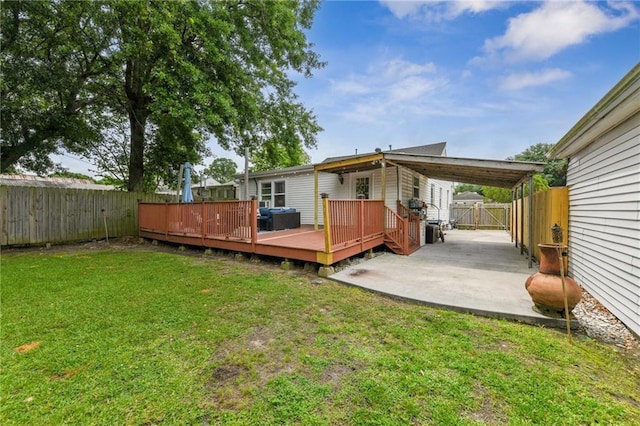 back of house with a fenced backyard, a wooden deck, a patio area, and a lawn