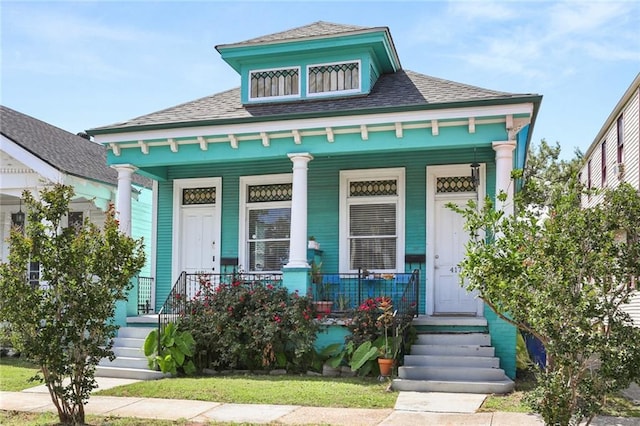 41719 S Genois St, New Orleans, LA 70119 - view of front facade with covered porch and roof with shingles