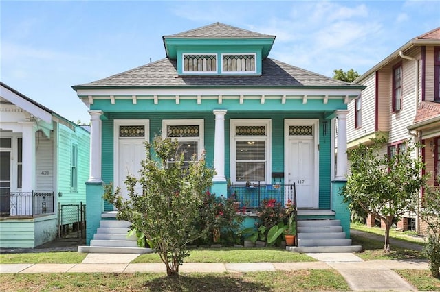 41719 S Genois St, New Orleans, LA 70119 - view of front of home featuring roof with shingles and covered porch