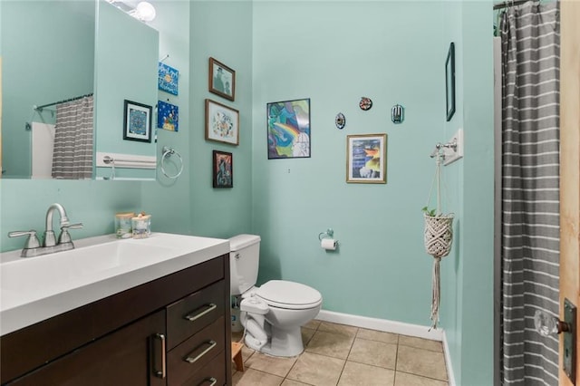 41719 S Genois St, New Orleans, LA 70119 - bathroom featuring toilet, baseboards, tile patterned floors, and vanity