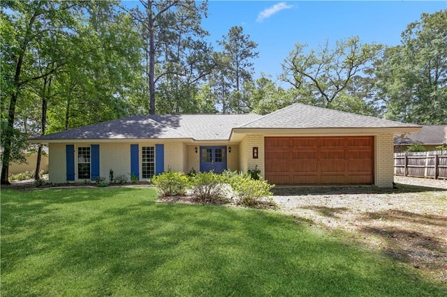 68 Begonia Dr, Covington, LA 70433 - ranch-style home with fence, an attached garage, brick siding, driveway, and a front lawn