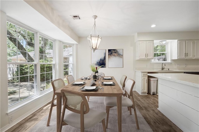 68 Begonia Dr, Covington, LA 70433 - dining area with recessed lighting, baseboards, dark wood finished floors, visible vents, and a chandelier