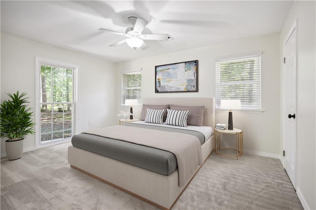 68 Begonia Dr, Covington, LA 70433 - bedroom with baseboards, a ceiling fan, and light colored carpet