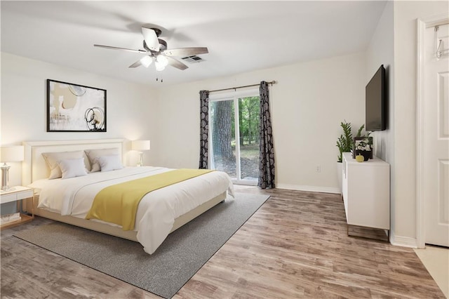 68 Begonia Dr, Covington, LA 70433 - bedroom with light wood finished floors, visible vents, baseboards, and access to exterior