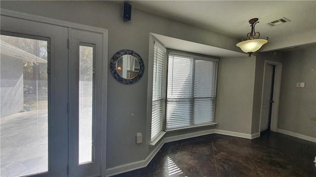 foyer featuring baseboards