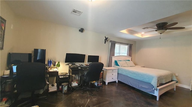 bedroom with an office area and a ceiling fan