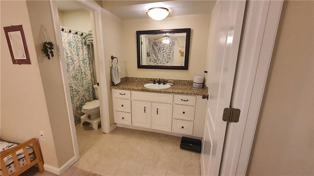 bathroom featuring toilet, vanity, baseboards, tile patterned flooring, and curtained shower