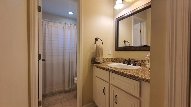 bathroom with toilet, vanity, a shower with shower curtain, and recessed lighting