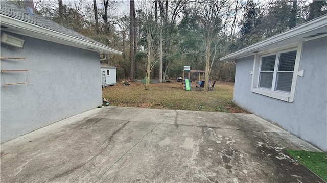 view of patio with view of wooded area