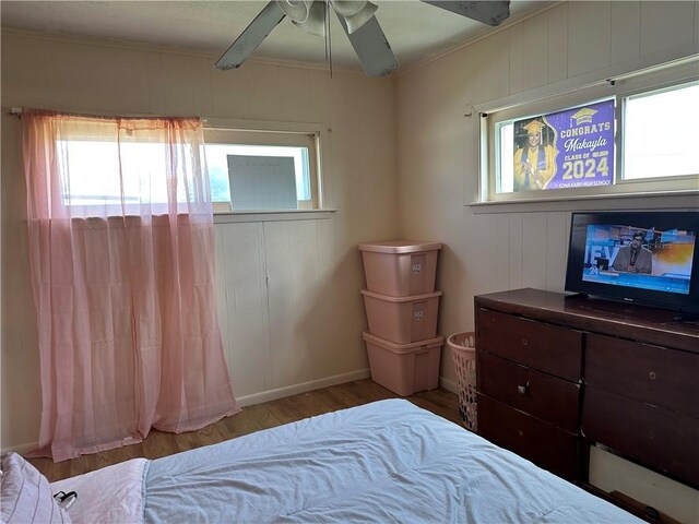 3024 Kansas St, New Orleans, LA 70114 - bedroom with multiple windows, wood finished floors, and crown molding