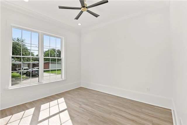 empty room with recessed lighting, crown molding, ceiling fan, baseboards, and light wood-style floors