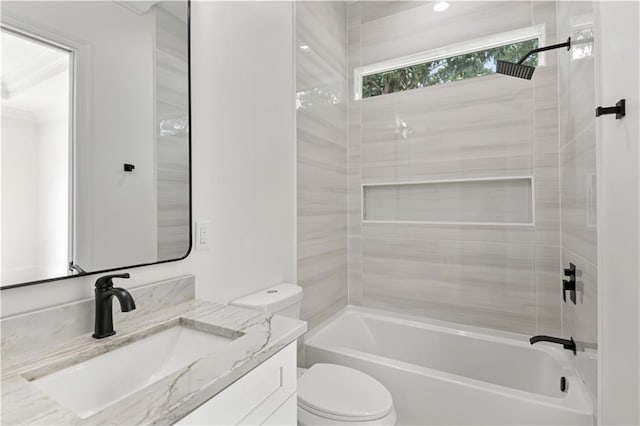 bathroom with vanity, toilet, and shower / tub combination