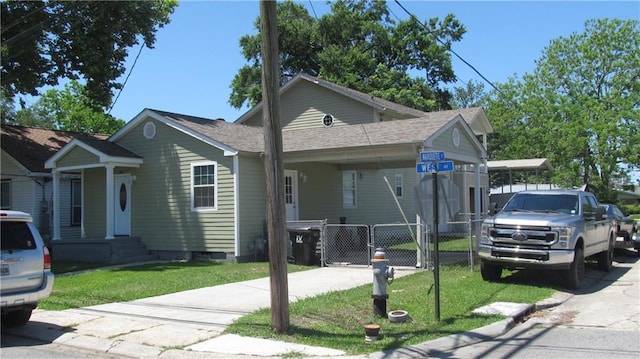 362 W Ave, Harahan, LA 70123 - view of front of property featuring a gate, fence, a front yard, and driveway