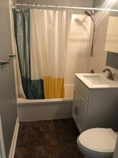 362 W Ave, Harahan, LA 70123 - bathroom featuring shower / bath combination with curtain, toilet, and vanity