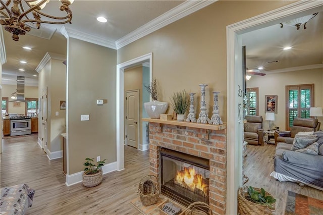 929 W 17th Ave, Covington, LA 70433 - living room featuring ornamental molding, a brick fireplace, and wood finished floors