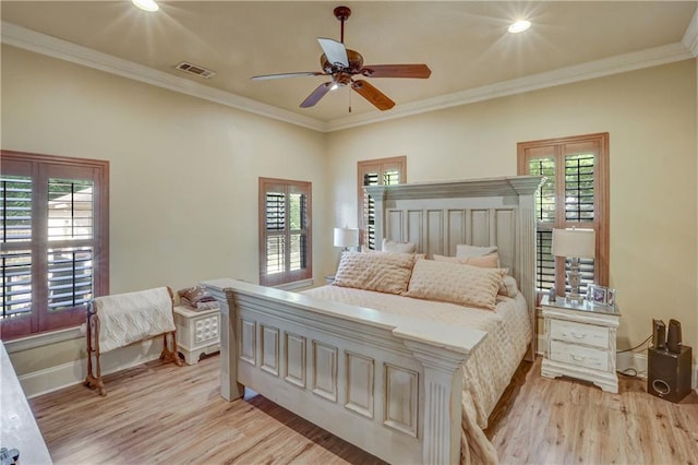 929 W 17th Ave, Covington, LA 70433 - bedroom featuring baseboards, crown molding, light wood-style flooring, and visible vents