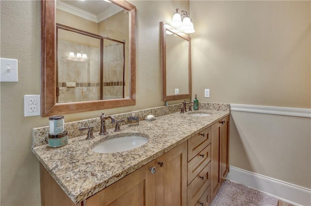 929 W 17th Ave, Covington, LA 70433 - full bathroom featuring double vanity, crown molding, a shower stall, and a sink