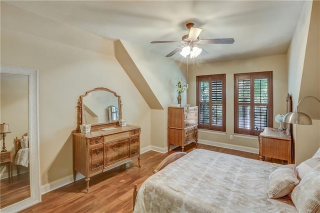 929 W 17th Ave, Covington, LA 70433 - bedroom featuring baseboards, a ceiling fan, and wood finished floors