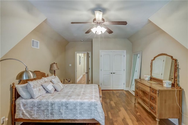 929 W 17th Ave, Covington, LA 70433 - bedroom featuring ceiling fan, a closet, visible vents, and wood finished floors