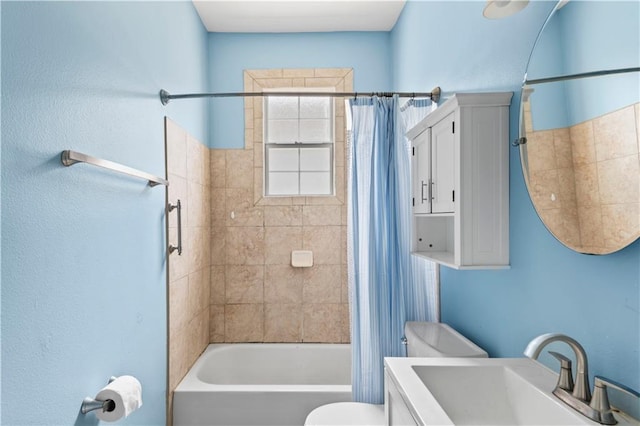 bathroom featuring toilet, shower / bath combination with curtain, and vanity