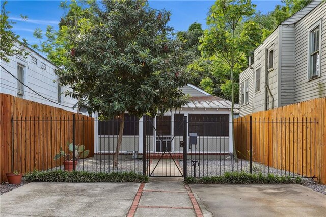 exterior space with a patio area, fence private yard, and a gate