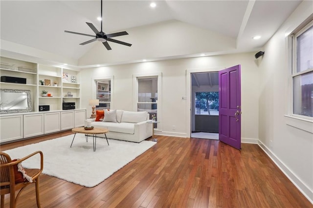 living room with lofted ceiling, a ceiling fan, recessed lighting, and wood finished floors