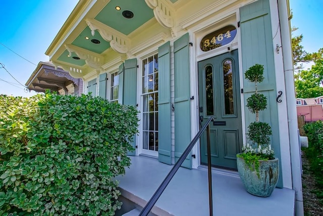 view of exterior entry featuring a porch