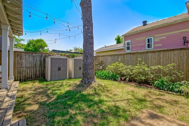 view of yard with a storage shed and an outdoor structure