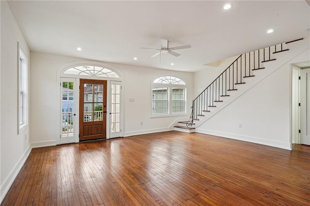 foyer entrance featuring a ceiling fan, hardwood / wood-style flooring, stairway, recessed lighting, and baseboards