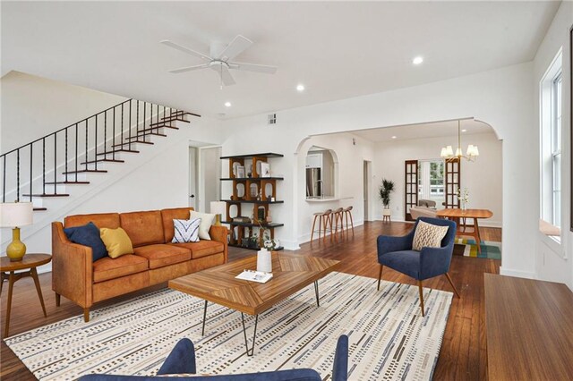 925 Picheloup Pl, New Orleans, LA 70119 - living room featuring arched walkways, wood finished floors, a ceiling fan, and recessed lighting
