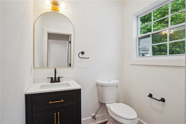bathroom with toilet and vanity
