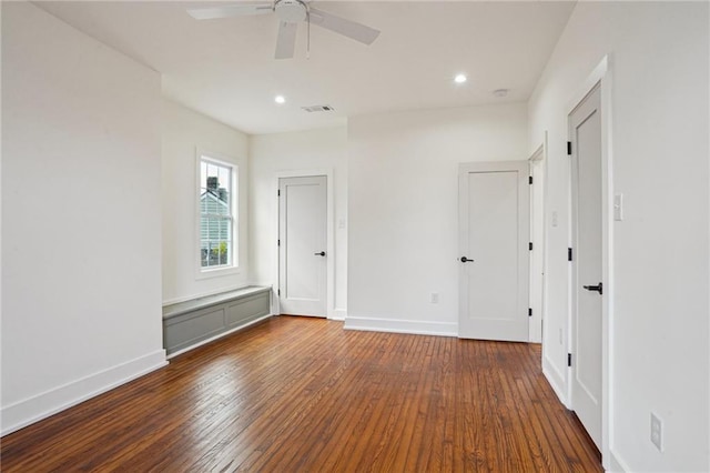 empty room with hardwood / wood-style flooring, ceiling fan, baseboards, and recessed lighting