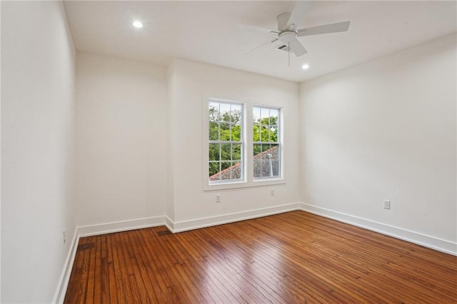 empty room featuring hardwood / wood-style floors, baseboards, ceiling fan, and recessed lighting