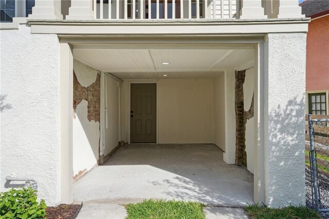 925 Picheloup Pl, New Orleans, LA 70119 - view of exterior entry featuring stucco siding and a garage