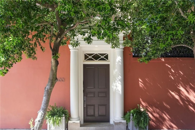 600 Governor Nicholls St, New Orleans, LA 70116 - doorway to property with stucco siding
