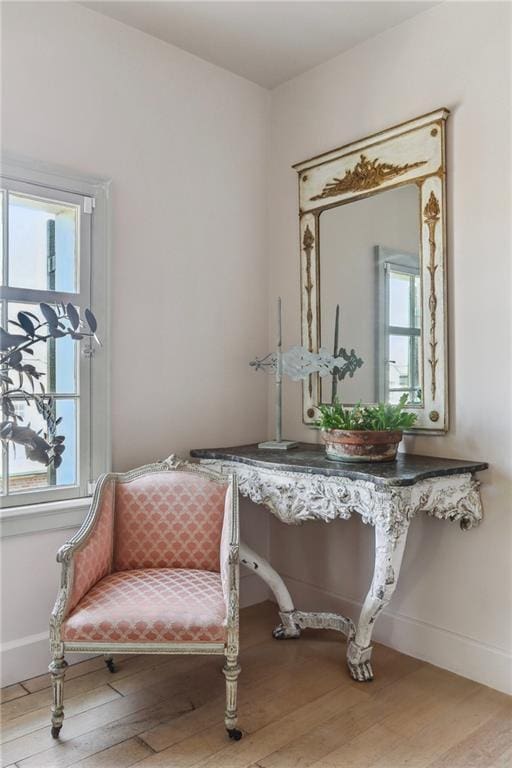 600 Governor Nicholls St, New Orleans, LA 70116 - living area featuring wood finished floors and baseboards