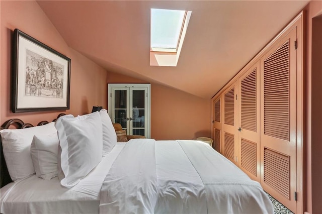 600 Governor Nicholls St, New Orleans, LA 70116 - bedroom featuring a skylight, lofted ceiling, a closet, and french doors