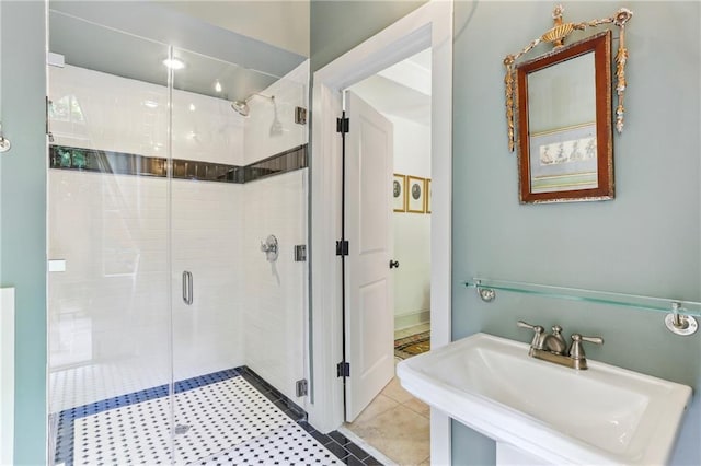 600 Governor Nicholls St, New Orleans, LA 70116 - full bathroom with a sink, a shower stall, and tile patterned flooring