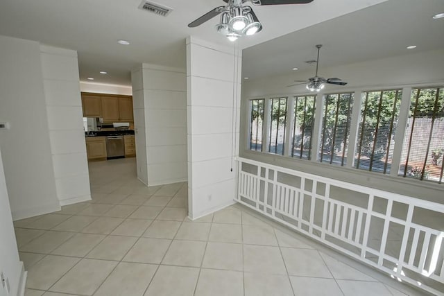 unfurnished dining area with light tile patterned flooring, a ceiling fan, visible vents, and recessed lighting
