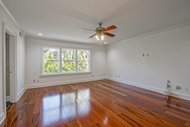 unfurnished room with ceiling fan, ornamental molding, baseboards, and wood finished floors