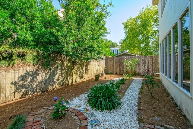 view of yard featuring a fenced backyard