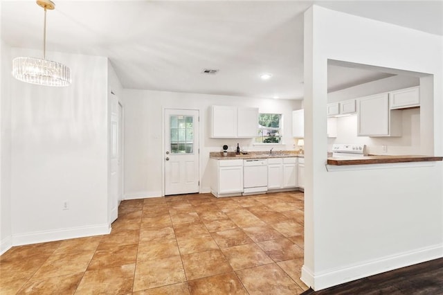 27155 Tag A Long Rd, Lacombe, LA 70445 - kitchen with an inviting chandelier, a sink, white cabinetry, range, and dishwasher