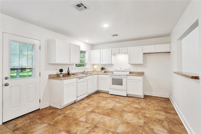 27155 Tag A Long Rd, Lacombe, LA 70445 - kitchen with a sink, white cabinets, visible vents, baseboards, and white appliances