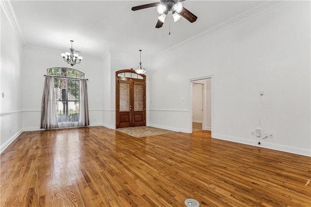 400 Brown Thrasher Loop, Madisonville, LA 70447 - interior space featuring light wood-style floors, baseboards, ceiling fan with notable chandelier, and ornamental molding