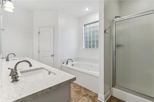 400 Brown Thrasher Loop, Madisonville, LA 70447 - full bath with double vanity, a sink, a tub with jets, a shower stall, and recessed lighting