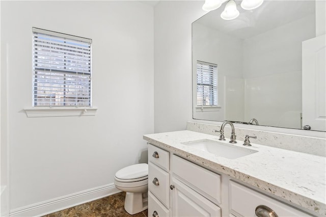400 Brown Thrasher Loop, Madisonville, LA 70447 - bathroom with walk in shower, toilet, vanity, an inviting chandelier, and baseboards
