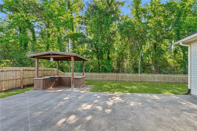 400 Brown Thrasher Loop, Madisonville, LA 70447 - view of patio with a fenced backyard, a gazebo, and a jacuzzi