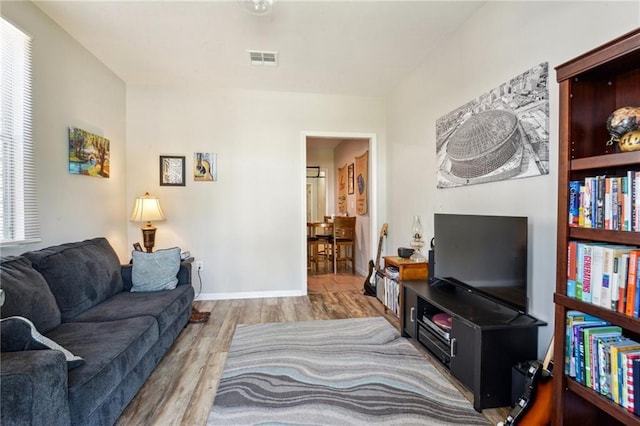3619-25 Delachaise St, New Orleans, LA 70125 - living area with visible vents and wood finished floors