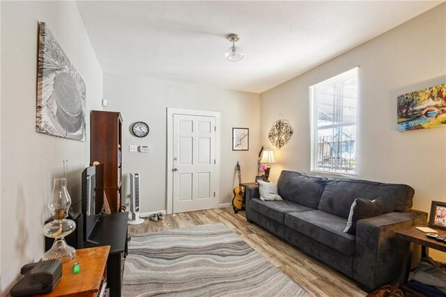 3619-25 Delachaise St, New Orleans, LA 70125 - living area with baseboards and light wood-style flooring