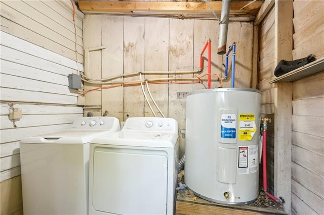 3619-25 Delachaise St, New Orleans, LA 70125 - laundry area with washing machine and clothes dryer, electric water heater, wooden walls, and laundry area